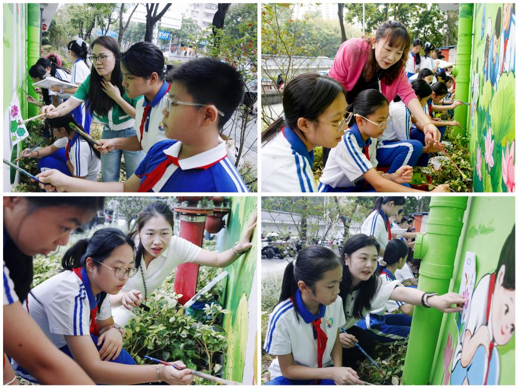 美术教师指导学生墙绘